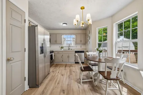 a view of a dining room with furniture window and outside view