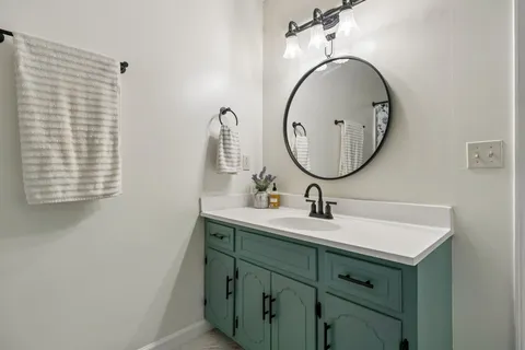a bathroom with a sink and a mirror