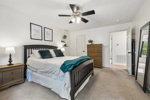 a bedroom with a bed and a walk in closet