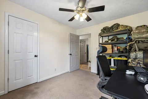 a view of a workspace with furniture