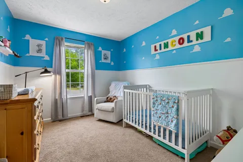a view of a baby crib in a bedroom