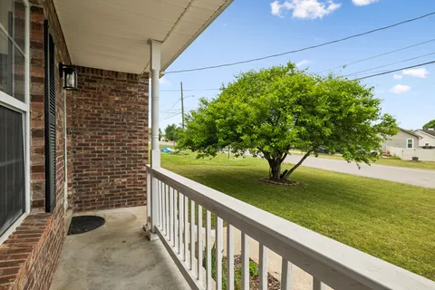 a view of a porch with a yard