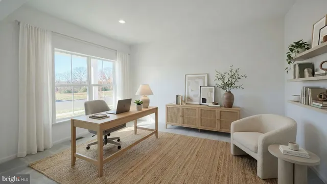 a work room with furniture and wooden floor