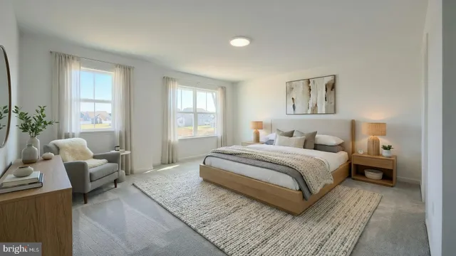 a bedroom with a large bed and a couch