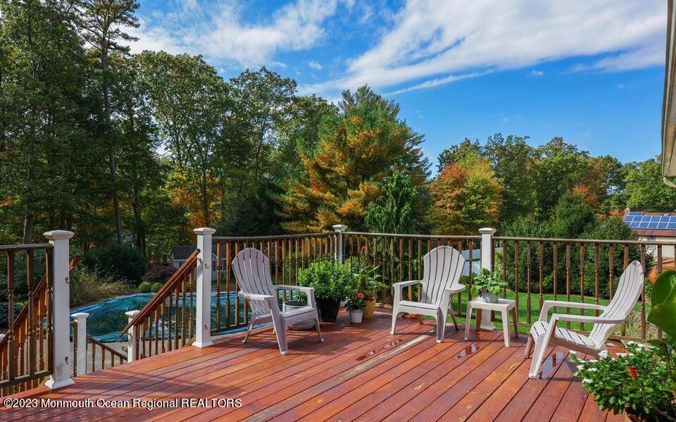 245 Delaware Trail Jackson, NJ 08527 - Photo 15 of 43 a view of balcony with two chairs and wooden fence