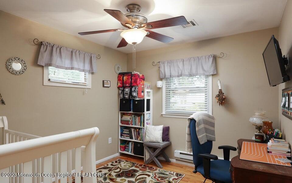 245 Delaware Trail Jackson, NJ 08527 - Photo 27 of 43 a living room with furniture a window and a flat screen tv