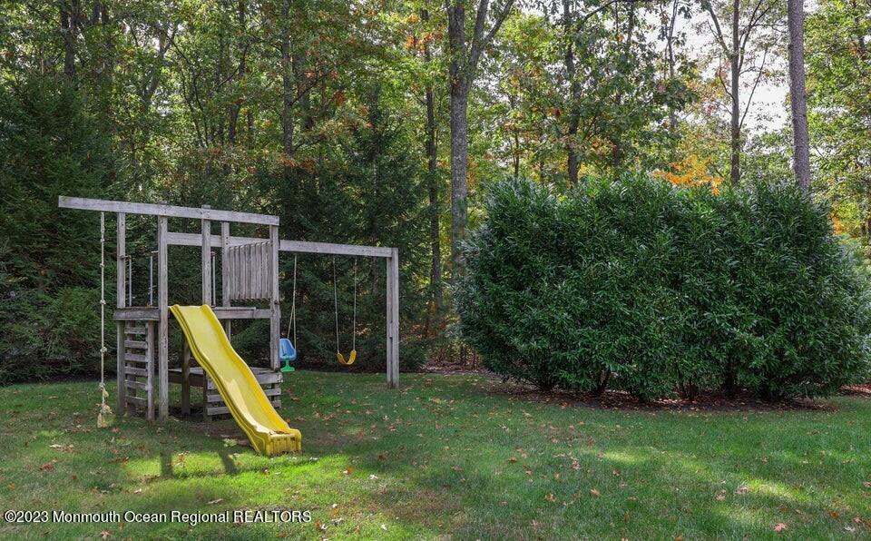 245 Delaware Trail Jackson, NJ 08527 - Photo 35 of 43 a view of a yard with a slide