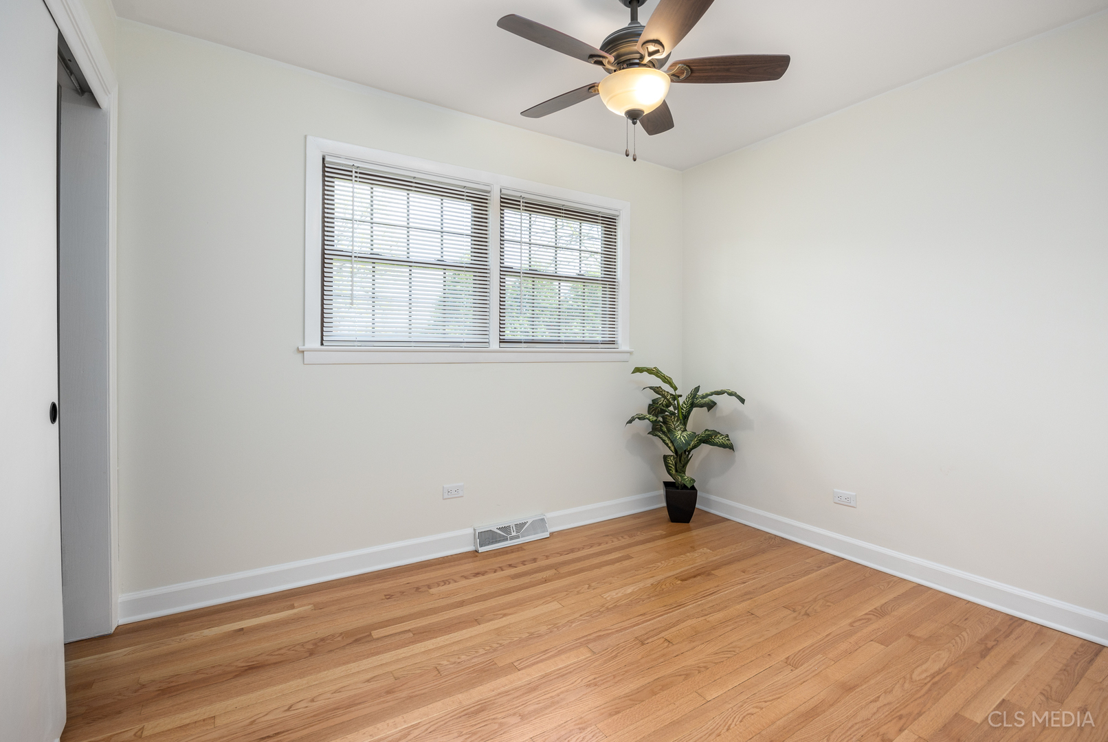 2112 Oakton Street Park Ridge, IL 60068 - Photo 11 of 24 a view of empty room with wooden floor and fan