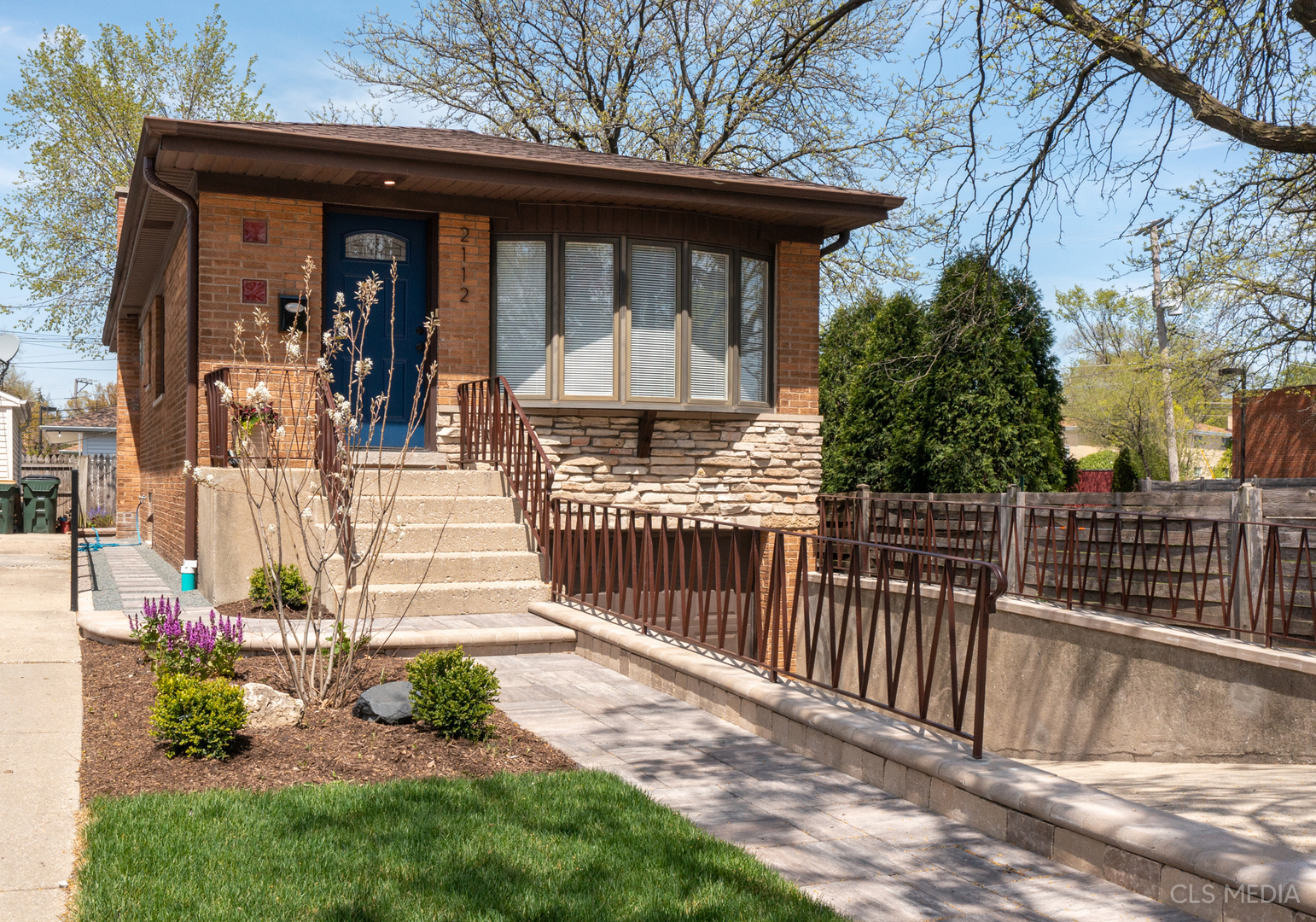 2112 Oakton Street Park Ridge, IL 60068 - Photo 2 of 24 a front view of a house having yard