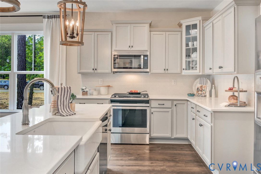 Lot 16 Pin Oak Loop Amelia Court House, VA 23002 - Photo 2 of 14 a kitchen with stainless steel appliances granite countertop a sink and cabinets with wooden floors