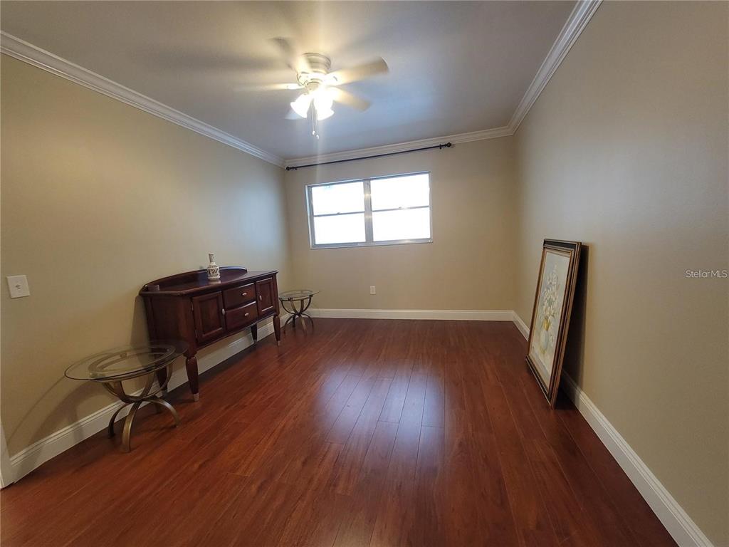 911 Washington Avenue Southwest, Unit 308 Largo, FL 33770 - Photo 13 of 24 a view of room with hardwood floor and workspace