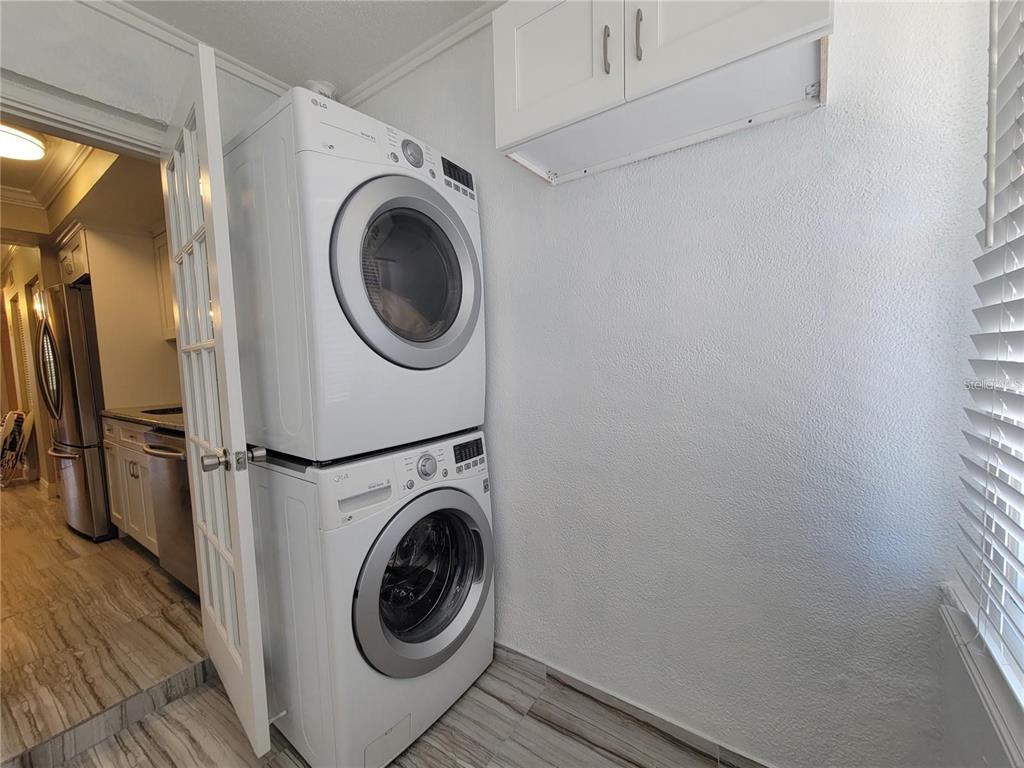 911 Washington Avenue Southwest, Unit 308 Largo, FL 33770 - Photo 18 of 24 a utility room with dryer and washer