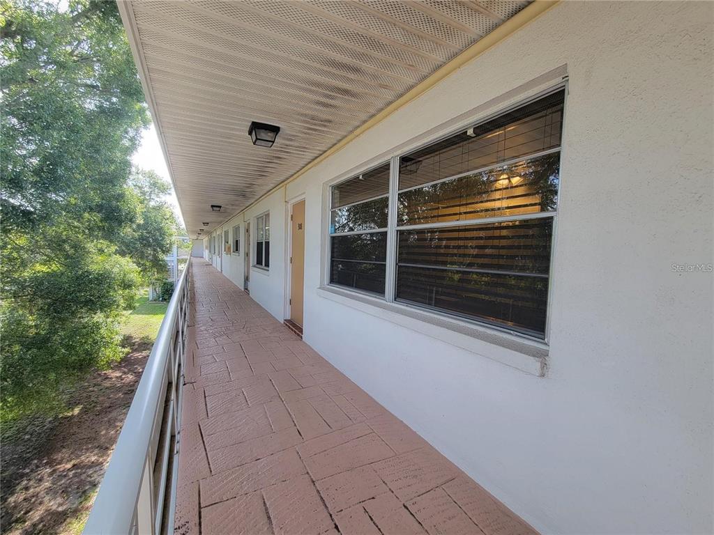 911 Washington Avenue Southwest, Unit 308 Largo, FL 33770 - Photo 21 of 24 a porch with seating space