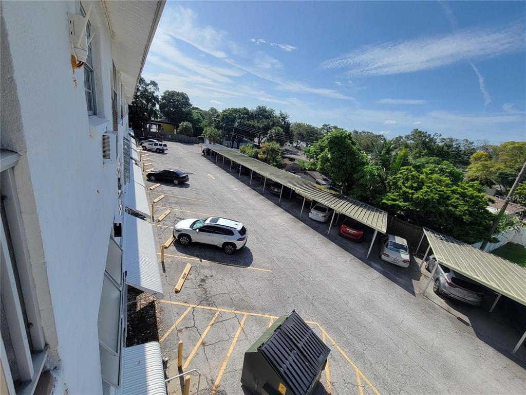 911 Washington Avenue Southwest, Unit 308 Largo, FL 33770 - Photo 22 of 24 with view of balcony with furniture and a garden