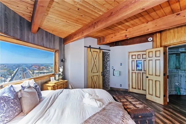 a view of a balcony with chair and wooden floor