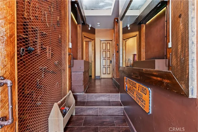 a living room with furniture and a ceiling fan