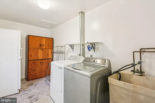 a view of a yard with a house and a tree