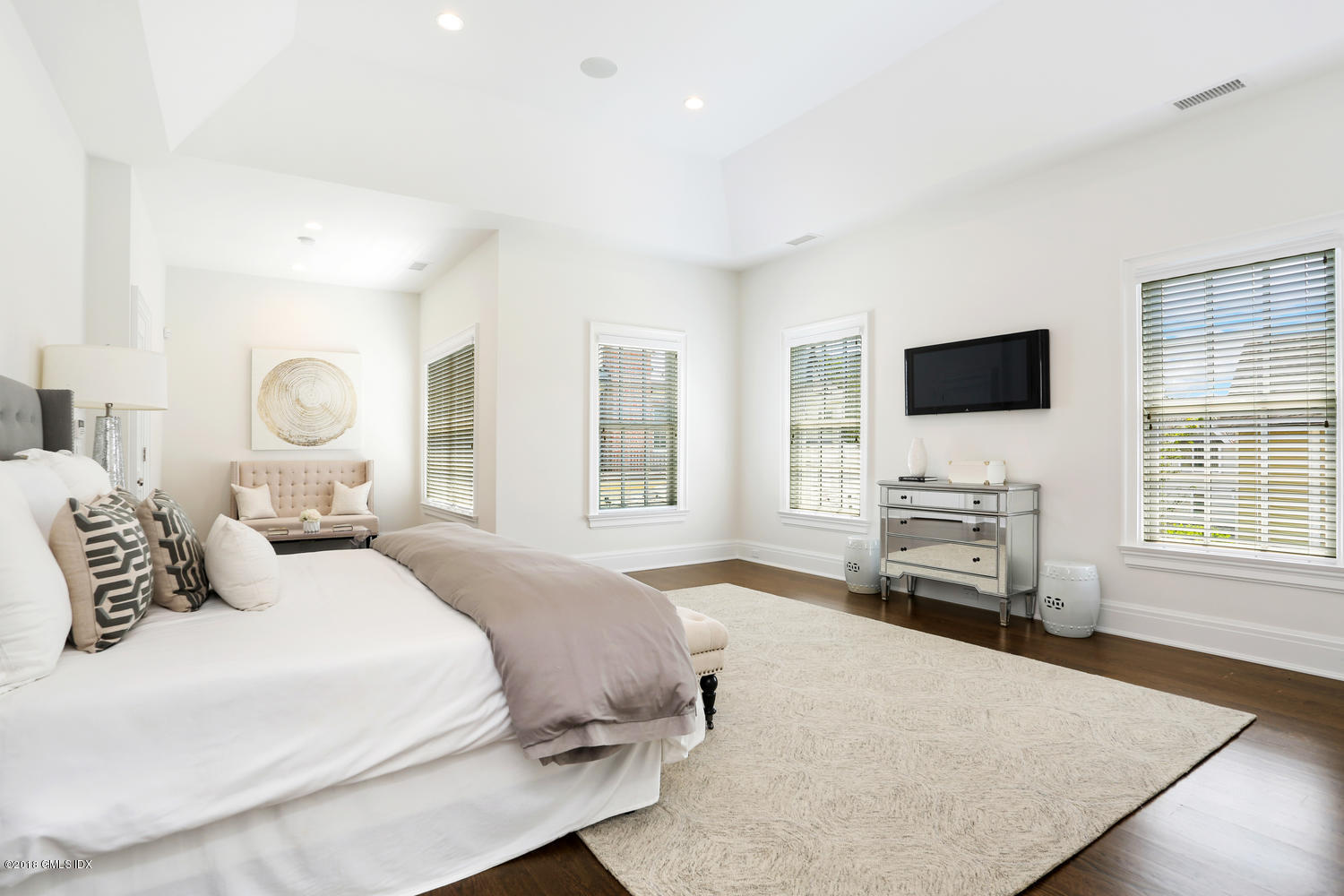 100 Lewis Street, Unit WEST Greenwich, CT 06830 - Photo 12 of 32 a bedroom with a bed and a flat screen tv