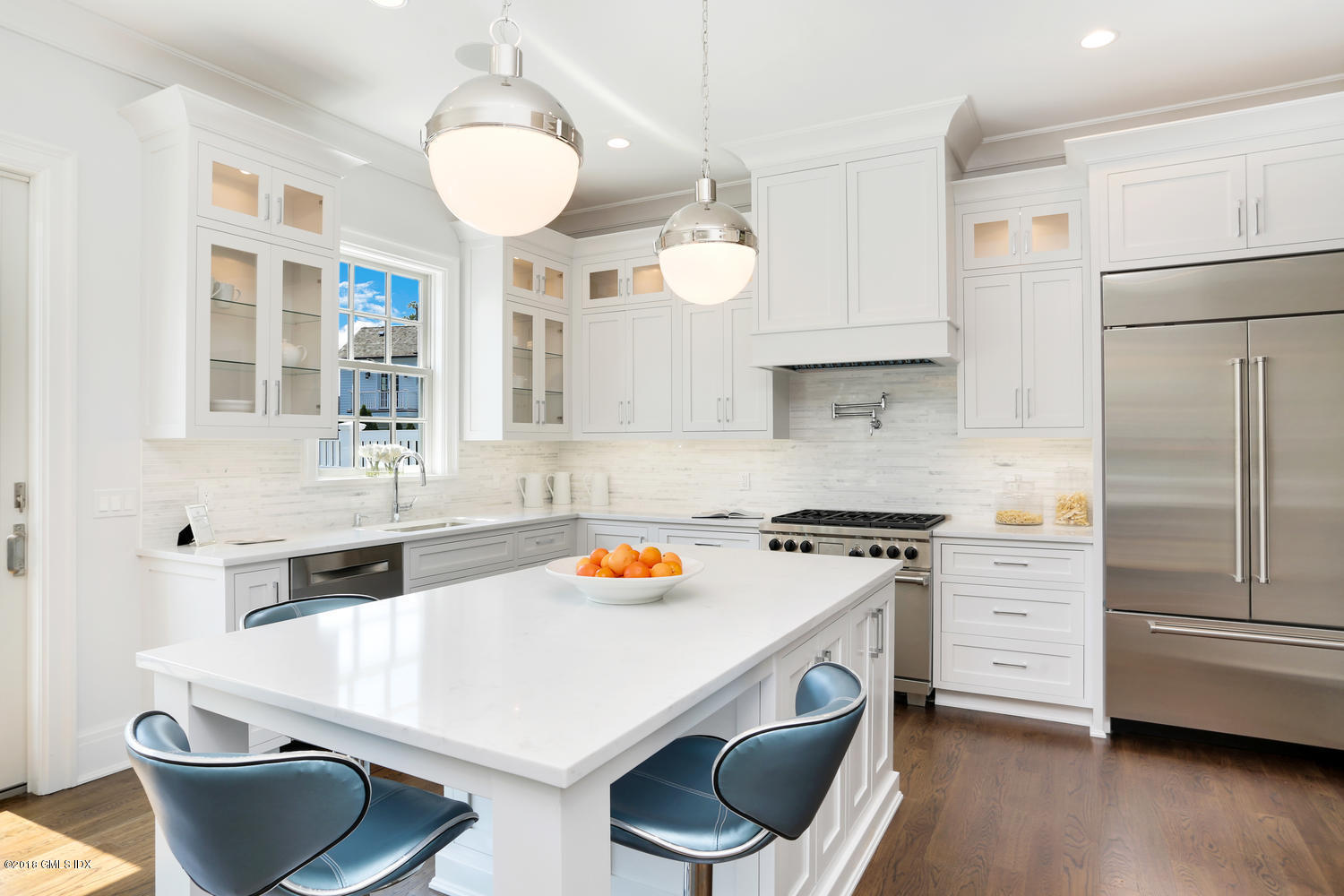 100 Lewis Street, Unit WEST Greenwich, CT 06830 - Photo 3 of 32 a kitchen with stainless steel appliances a stove a sink and a refrigerator