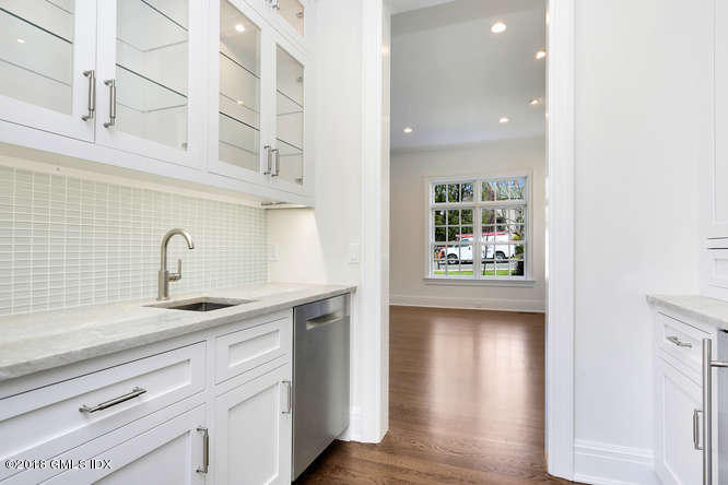 100 Lewis Street, Unit WEST Greenwich, CT 06830 - Photo 4 of 32 a view of a kitchen with a sink and cabinets