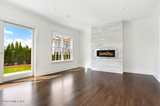 100 Lewis Street, Unit WEST Greenwich, CT 06830 - Photo 8 of 32 a view of a big room with wooden floor and windows