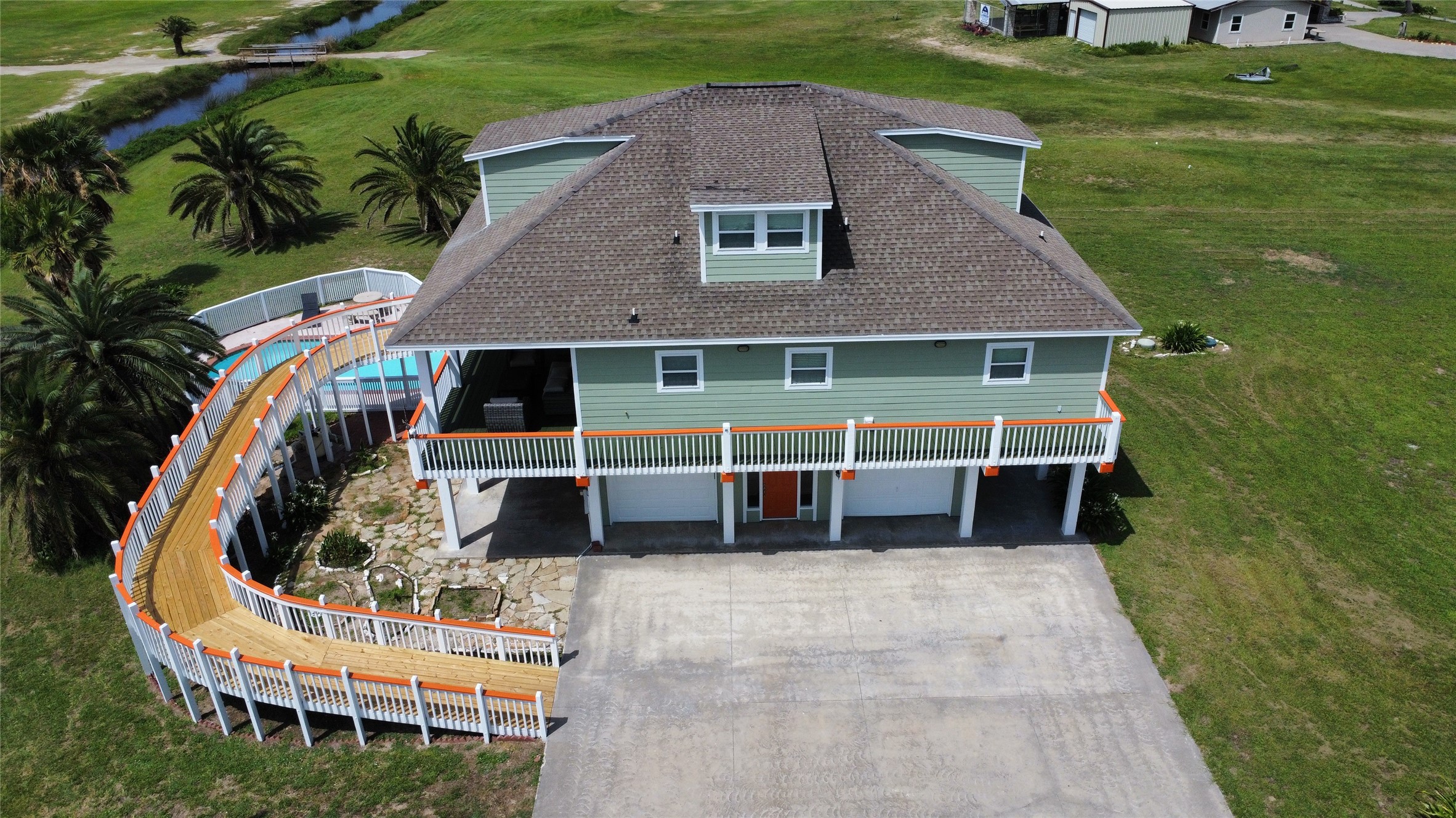 979 Rancho Carribe Drive Crystal Beach, TX 77650 - Photo 4 of 50 Aerial view of the home from the East