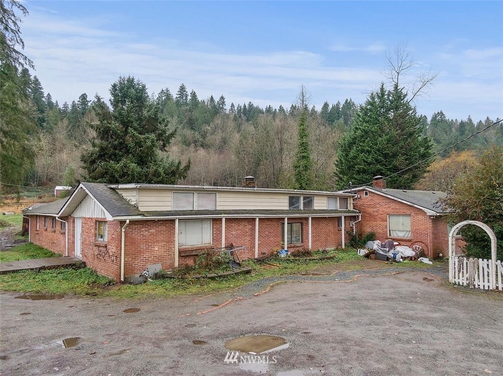 17849 Renton-Maple Valley Road Maple Valley, WA 98038 - Photo 1 of 33 a view of a house with a yard