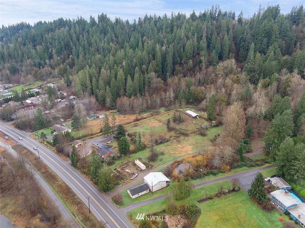 17849 Renton-Maple Valley Road Maple Valley, WA 98038 - Photo 29 of 33 a view of a city street lush green forest