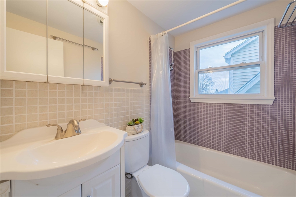 55 Sutherland Road, Unit 55 Arlington, MA 02476 - Photo 22 of 23 a bathroom with a sink toilet and shower