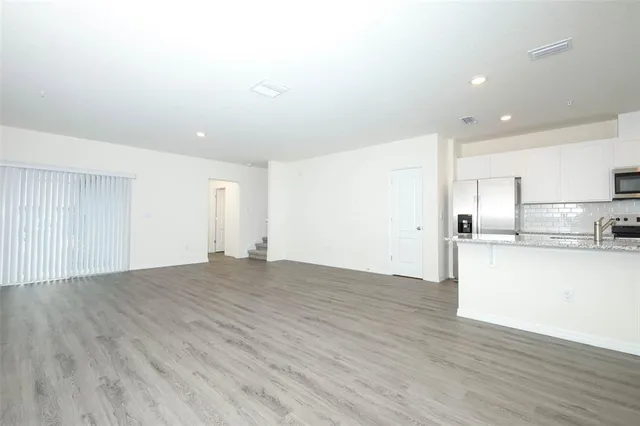 a view of kitchen with wooden floor