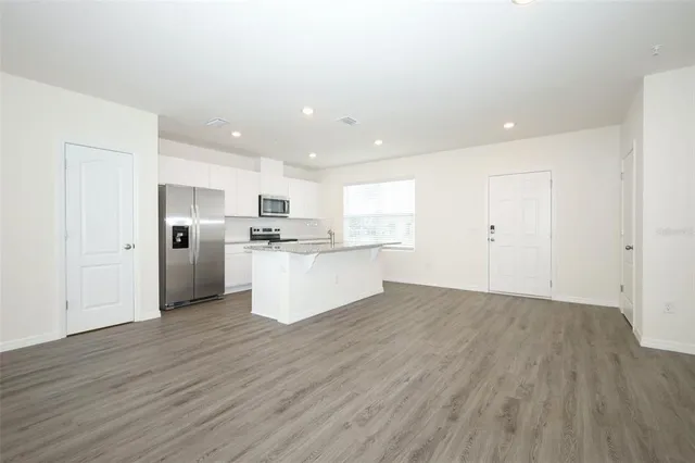a view of kitchen with wooden floor
