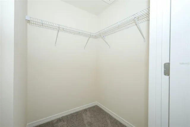 a view of an empty walk in closet