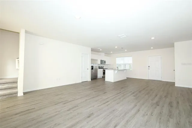 a view of a kitchen with wooden floor