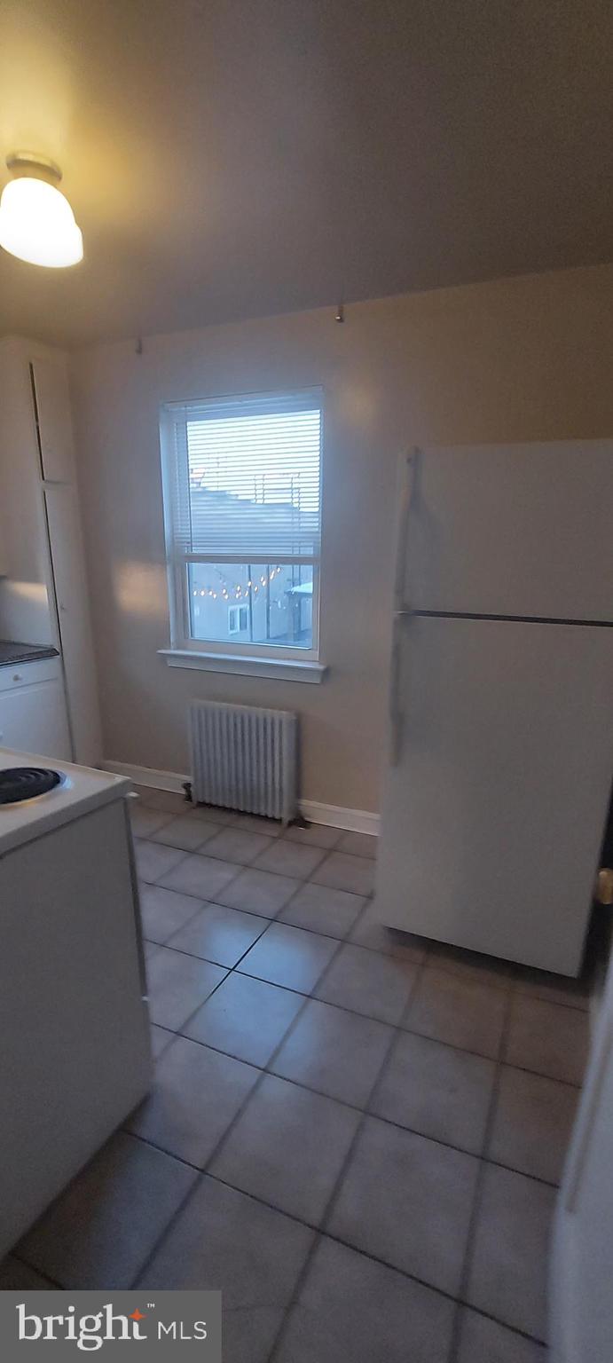 9863 Main Street, Unit 4 Damascus, MD 20872 - Photo 2 of 11 a view of a livingroom with an empty space and a window
