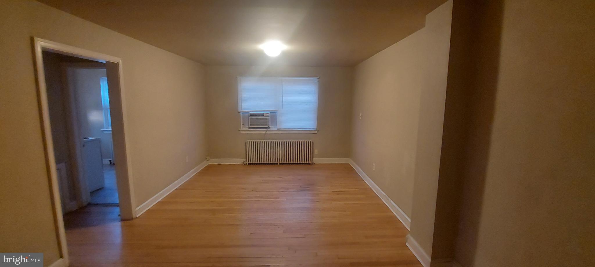 9863 Main Street, Unit 4 Damascus, MD 20872 - Photo 4 of 11 a view of hallway with wooden floor