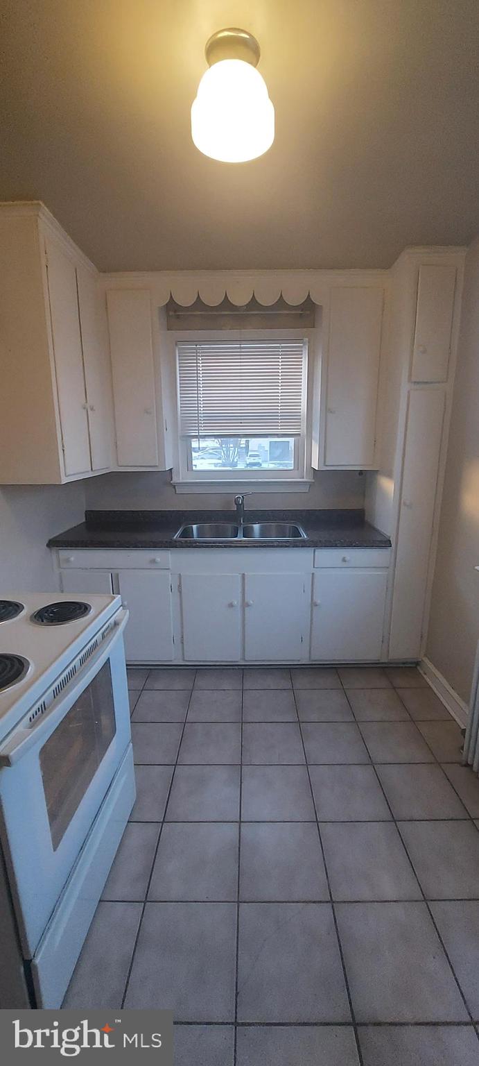9863 Main Street, Unit 4 Damascus, MD 20872 - Photo 7 of 11 a kitchen with a cabinets and window