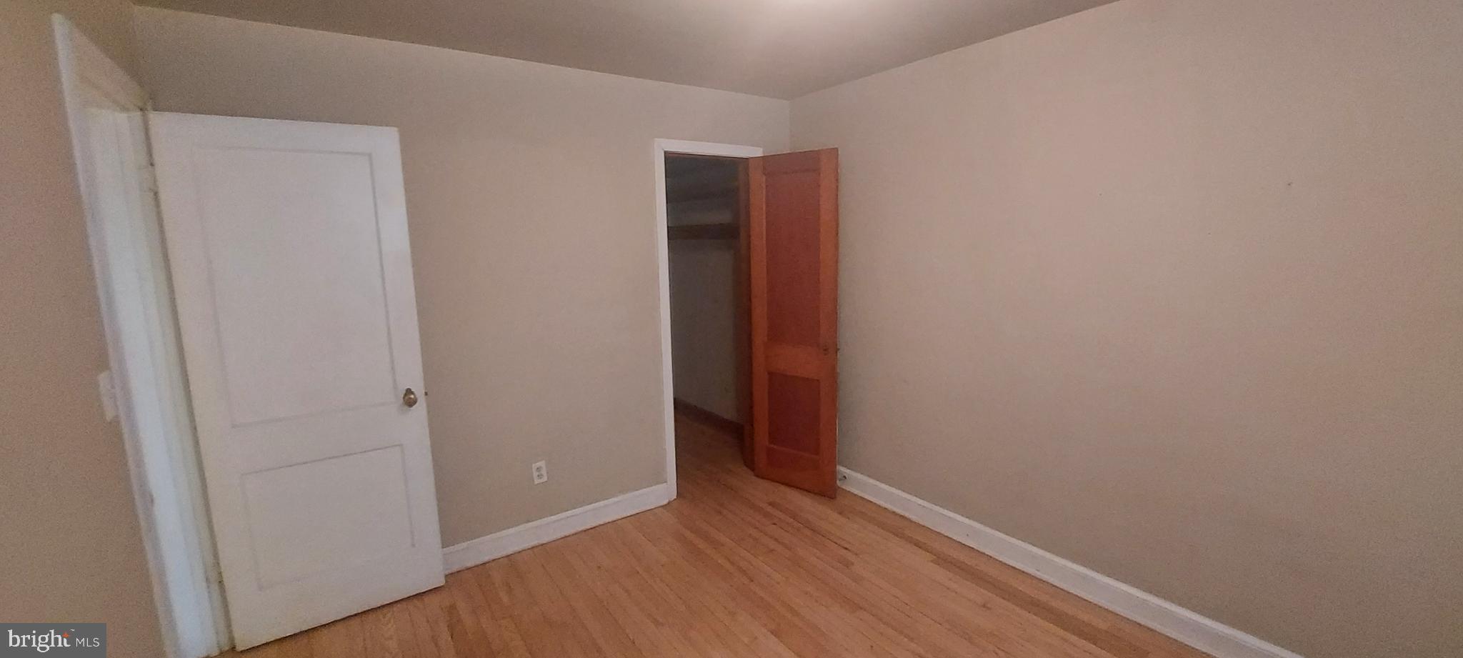 9863 Main Street, Unit 4 Damascus, MD 20872 - Photo 9 of 11 a view of an empty room with wooden floor