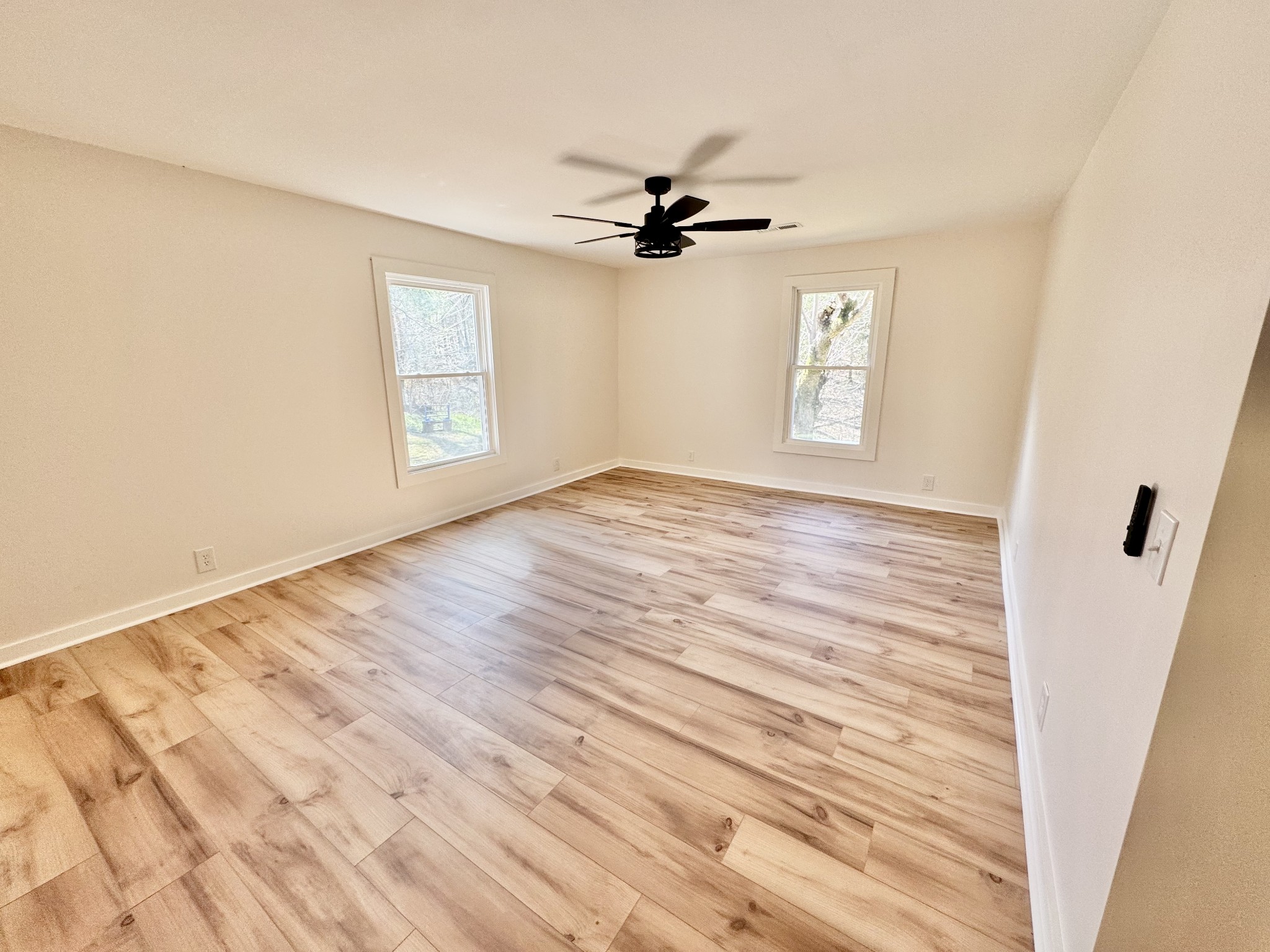 220 Friendship Hollow Road South Pleasant Shade, TN 37145 - Photo 7 of 50 wooden floor in an empty room with a window
