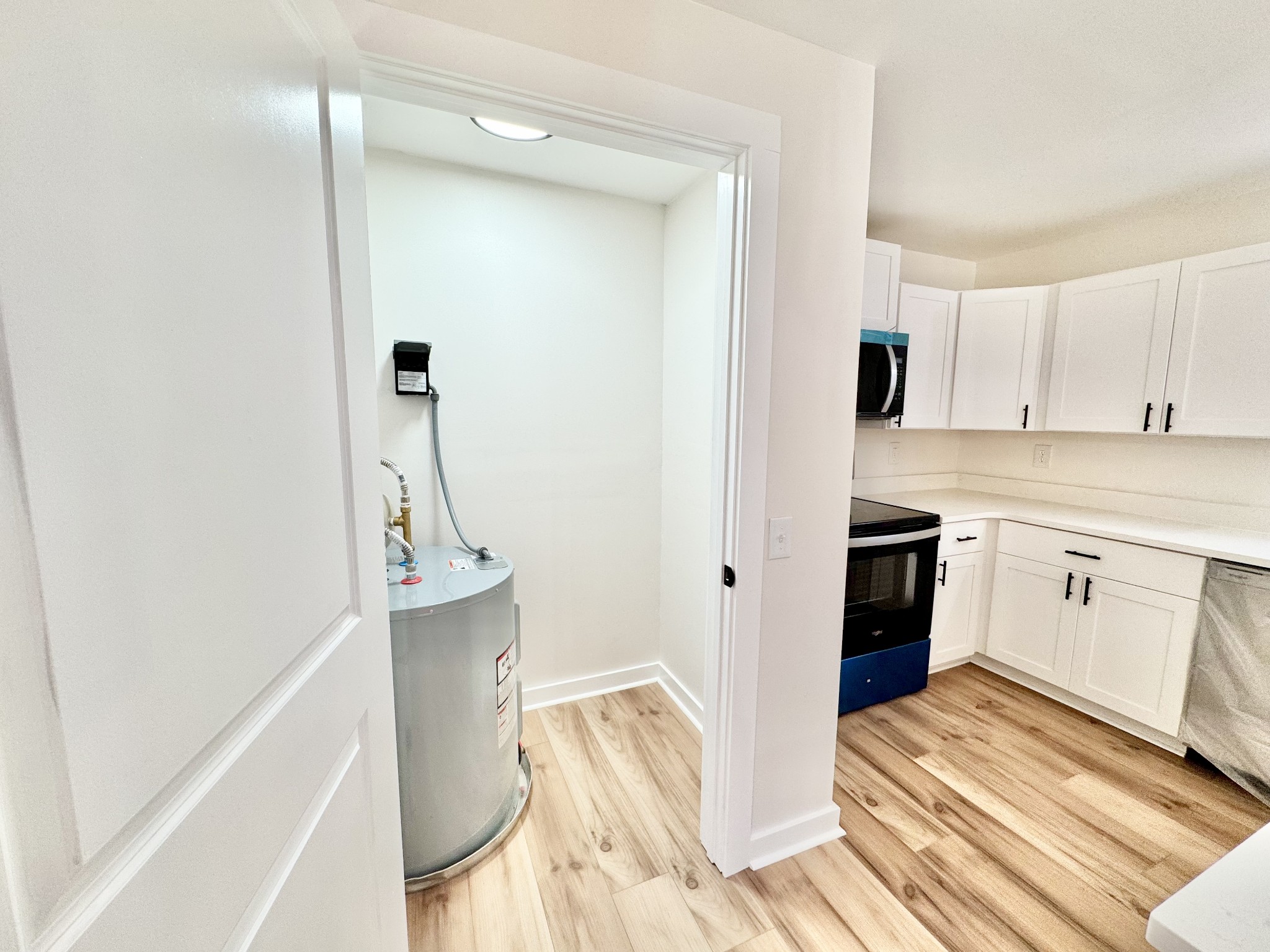 220 Friendship Hollow Road South Pleasant Shade, TN 37145 - Photo 8 of 50 a kitchen with a sink and white cabinets