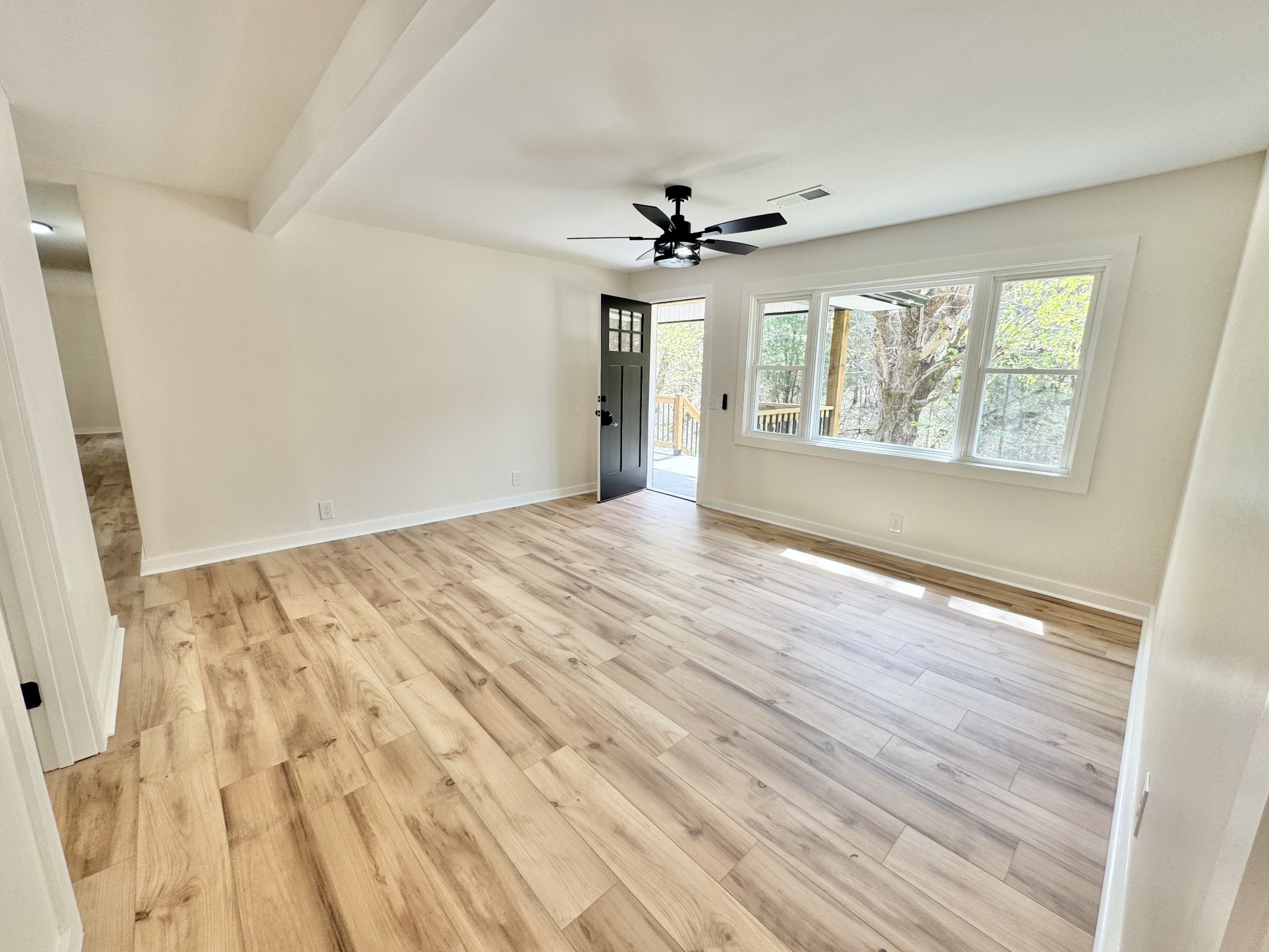 220 Friendship Hollow Road South Pleasant Shade, TN 37145 - Photo 9 of 50 wooden floor in an empty room with a window