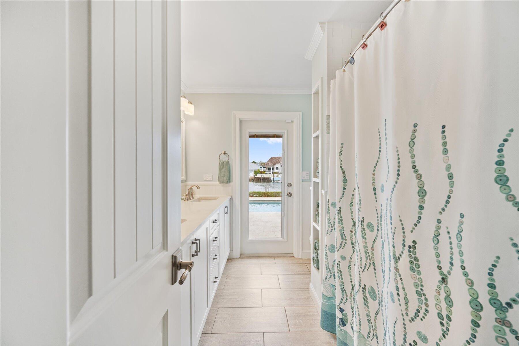 1180 Singer Drive Singer Island, FL 33404 - Photo 21 of 24 a bathroom with a shower and a sink