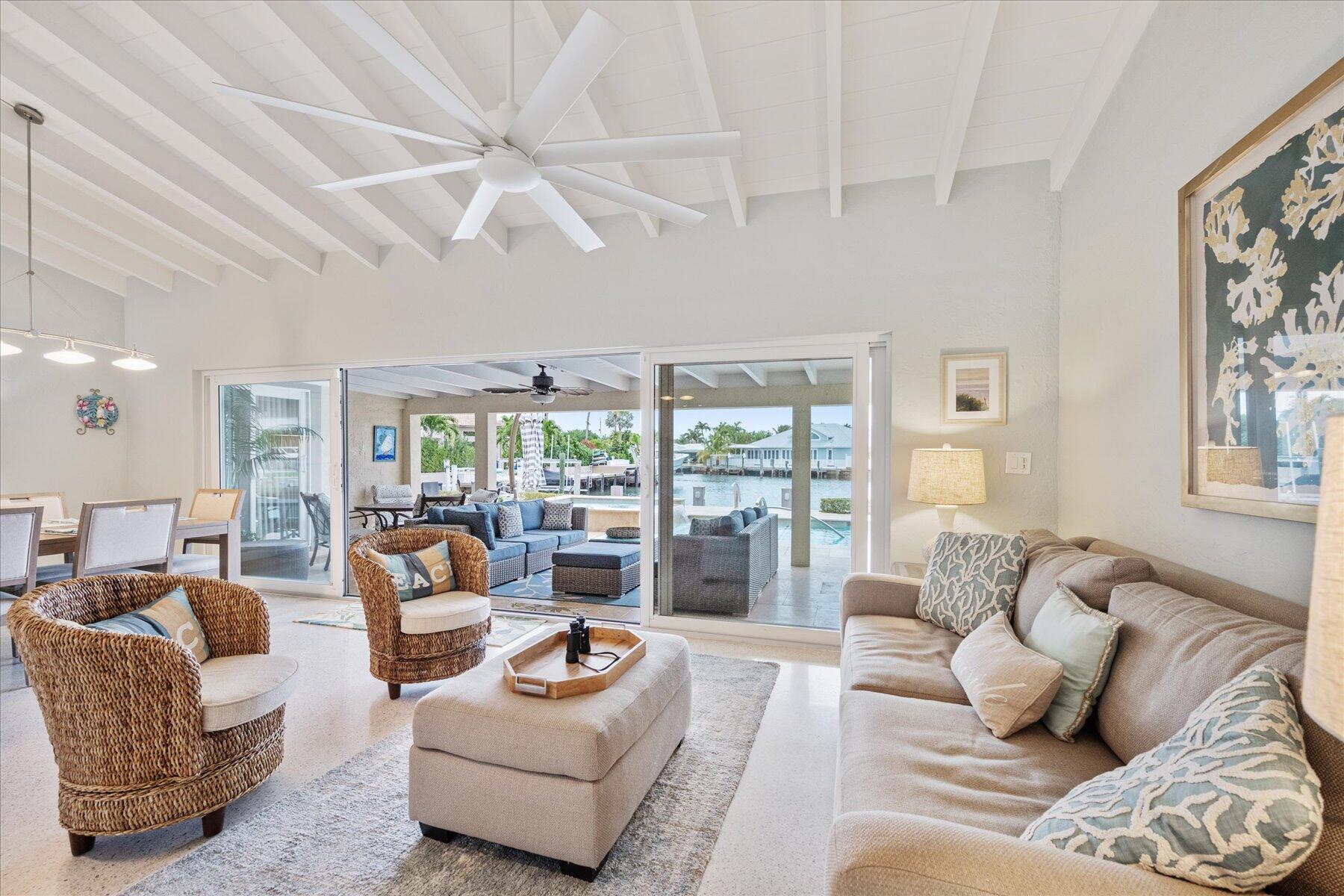 1180 Singer Drive Singer Island, FL 33404 - Photo 5 of 24 a living room with furniture and a large window