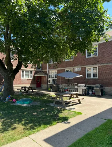 a swimming pool view with a outdoor seating