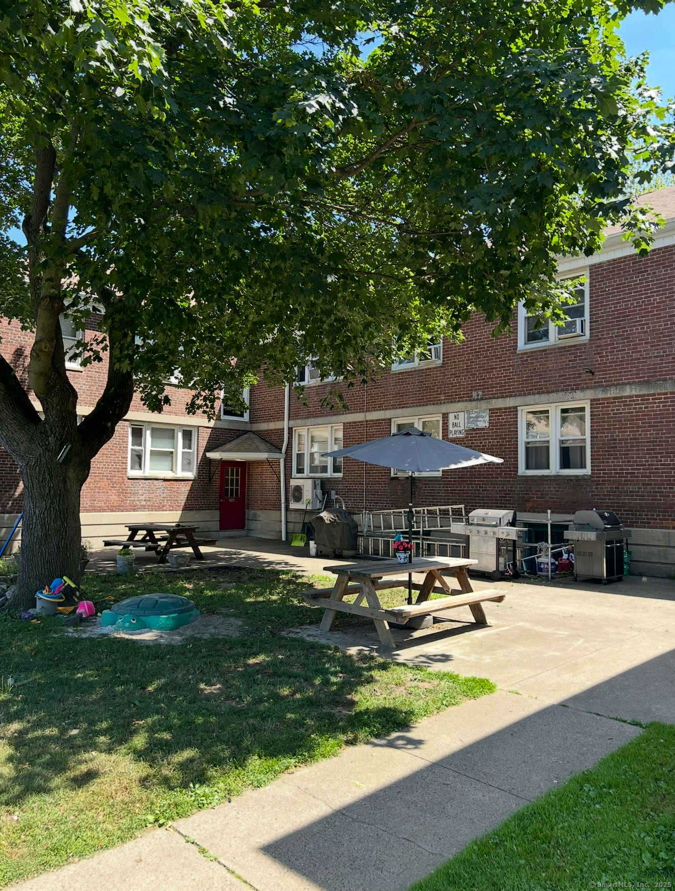 a swimming pool view with a outdoor seating