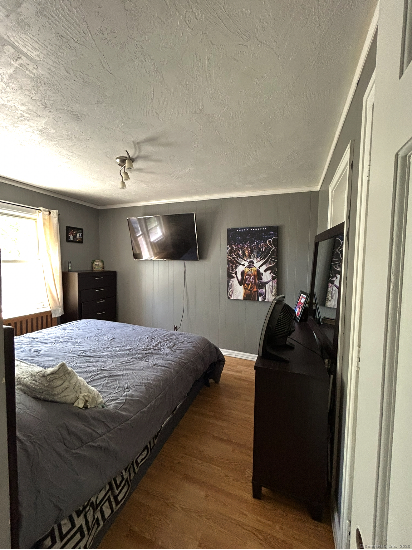 744 Canaan Road, Unit 23 Bridgeport, CT 06610 - Photo 12 of 14 a bedroom with a bed and a large mirror