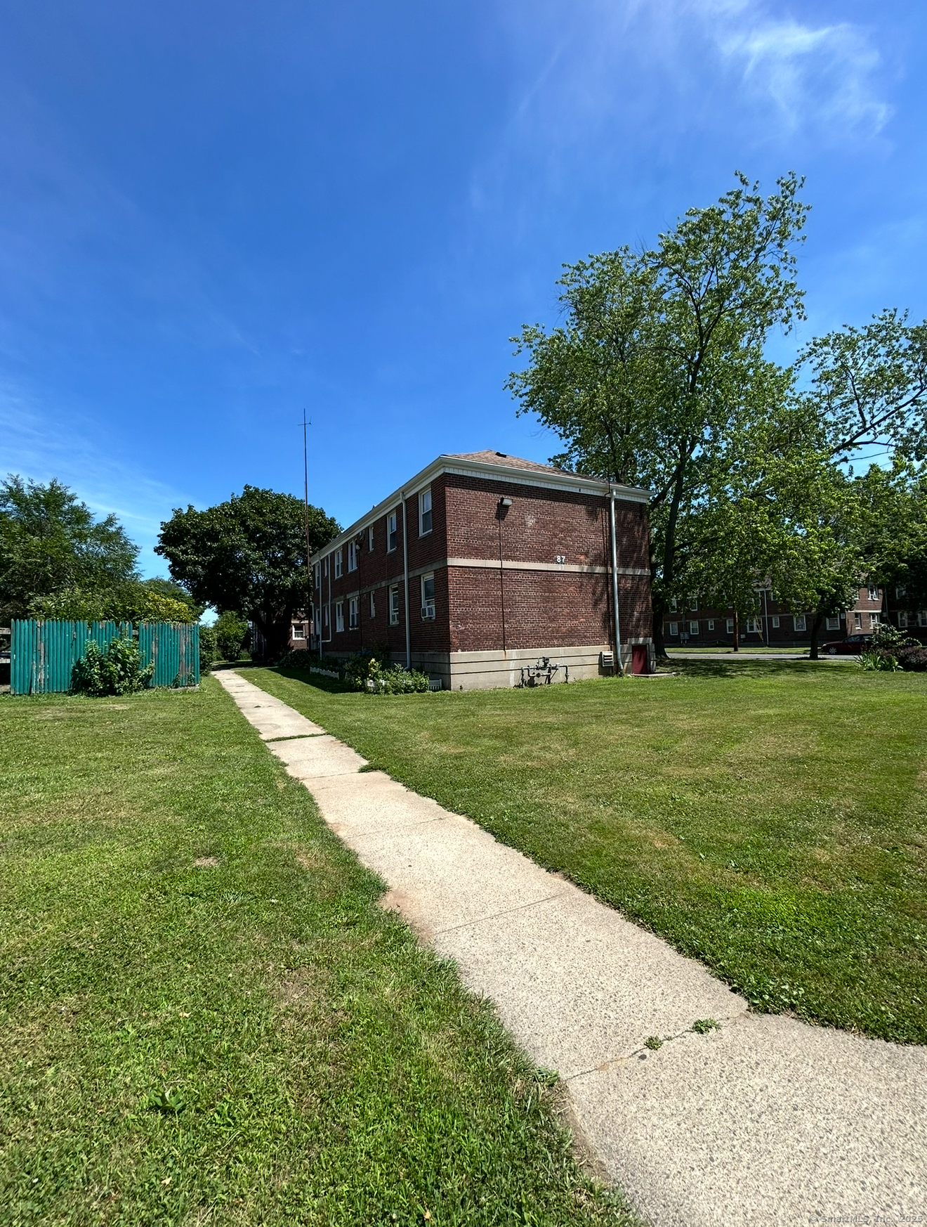 744 Canaan Road, Unit 23 Bridgeport, CT 06610 - Photo 2 of 14 a view of a house with backyard and garden