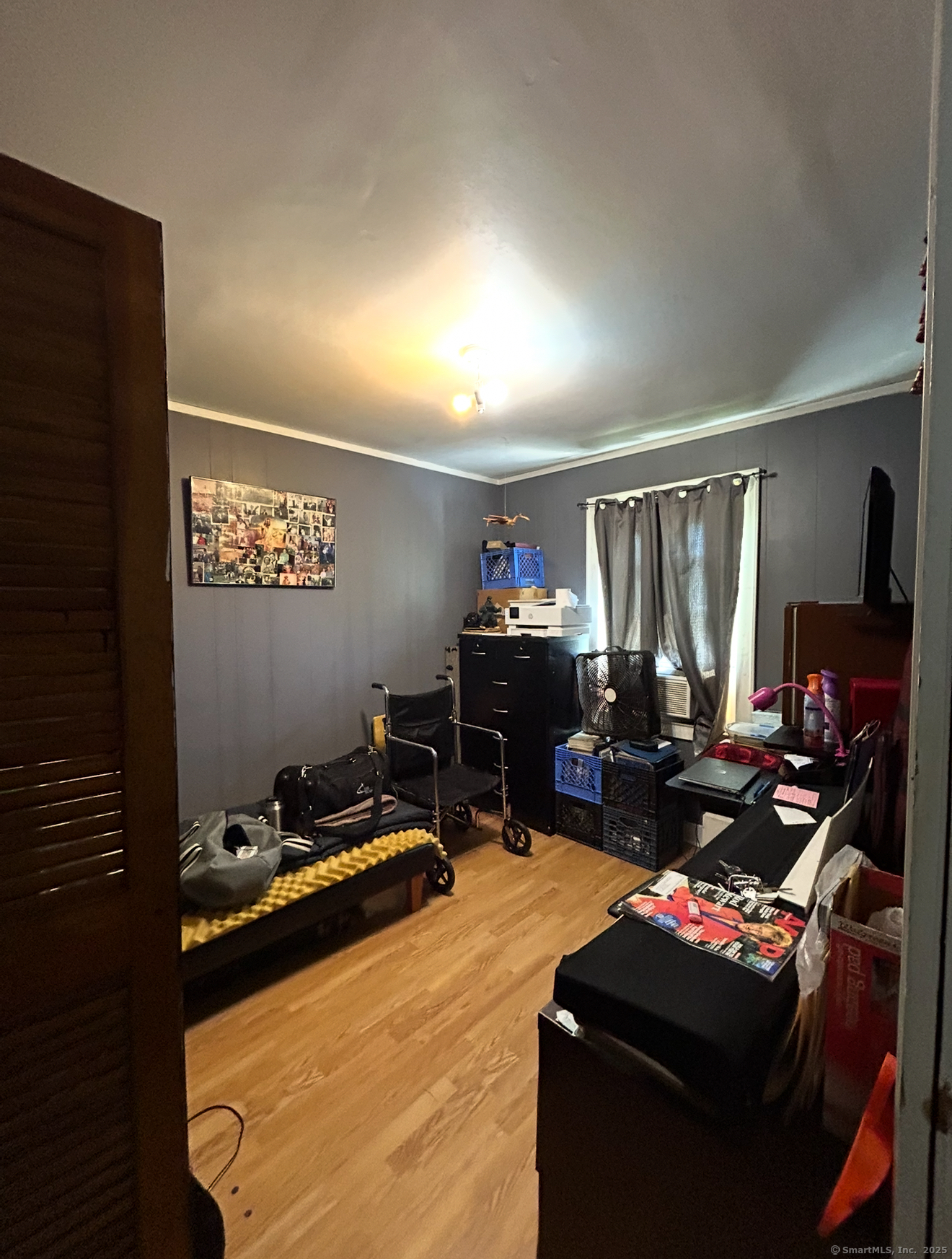 744 Canaan Road, Unit 23 Bridgeport, CT 06610 - Photo 10 of 14 a living room with furniture and a flat screen tv