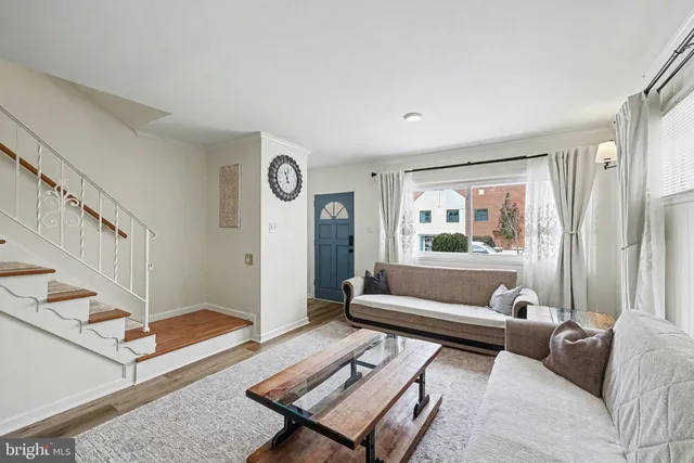 a living room with furniture and a rug
