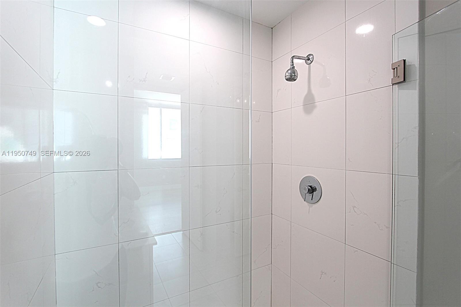 500 Brickell Avenue, Unit 4110 Miami, FL 33131 - Photo 13 of 34 a bathroom with a shower