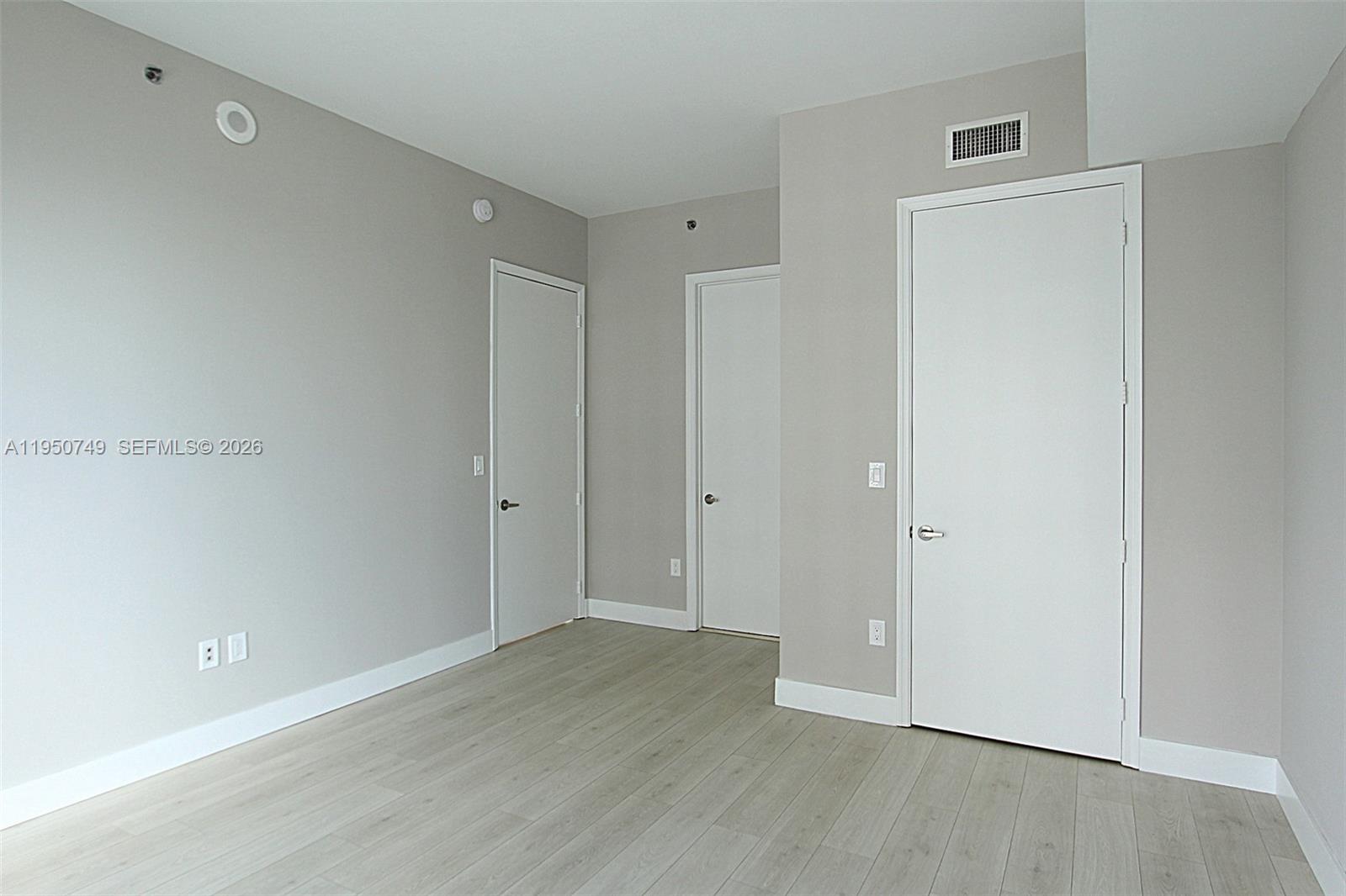 500 Brickell Avenue, Unit 4110 Miami, FL 33131 - Photo 24 of 34 a view of a room with wooden floor